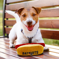 Pets First NFL New England Patriots HOT Dog Plush Dog & CAT Squeak Toy - Cutest HOT-Dog Snack Plush Toy for Dogs & Cats with Inner Squeaker & Beautiful Football Team Name/Logo 8 x 5 x 3 Inches NFL Stadium Hot Dog Toy