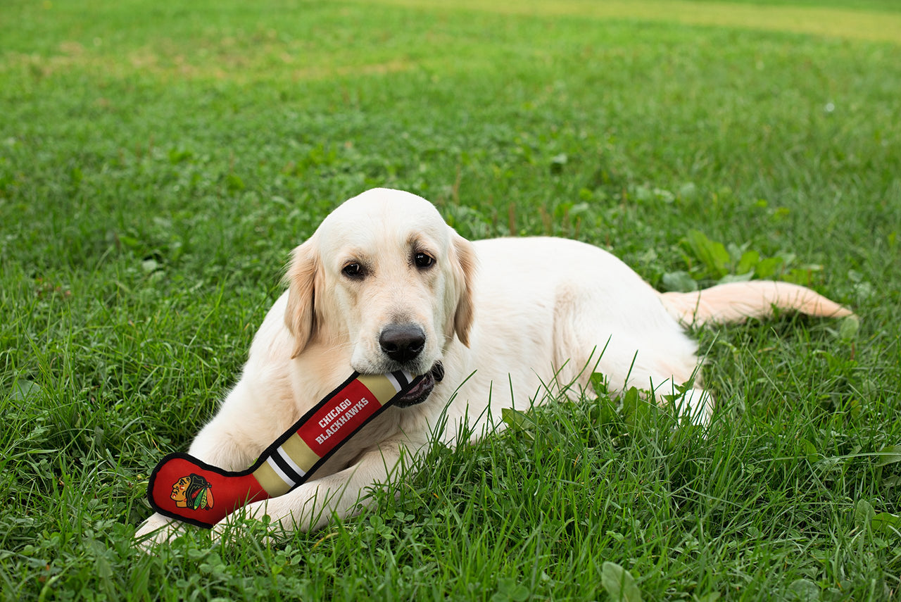 Pets First Dog Toy Tough Nylon with Inner Squeaker Licensed by NHL Chicago Blackhawks Hockey Stick Toy for Dogs & Cats. Play Hockey with Your Pet with This Licensed Dog Tough Toy